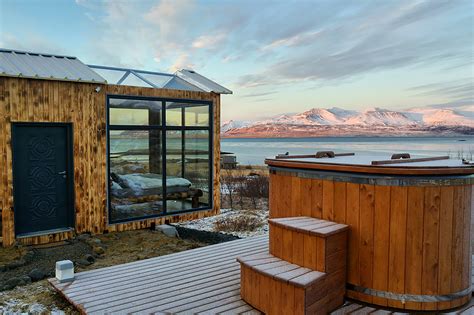 this glass cabin in iceland lets you watch the northern lights from your bed