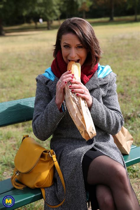 French Mom Anya Flashes Her Legs In Stockings While Eating A Sandwich Outside Free Porn Pics