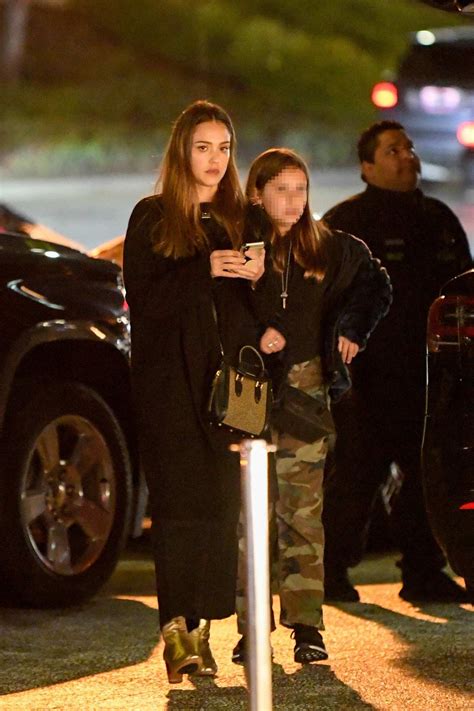 Jessica Alba Dons All Black Ensemble With A Pair Of Golden Boots As She Takes Her Daughters To A
