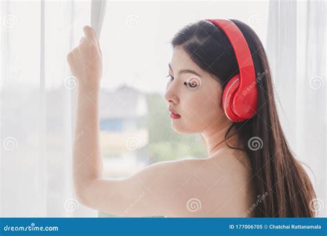 Beautiful Woman Wearing Red Headphones Listening To Music Happy Stock