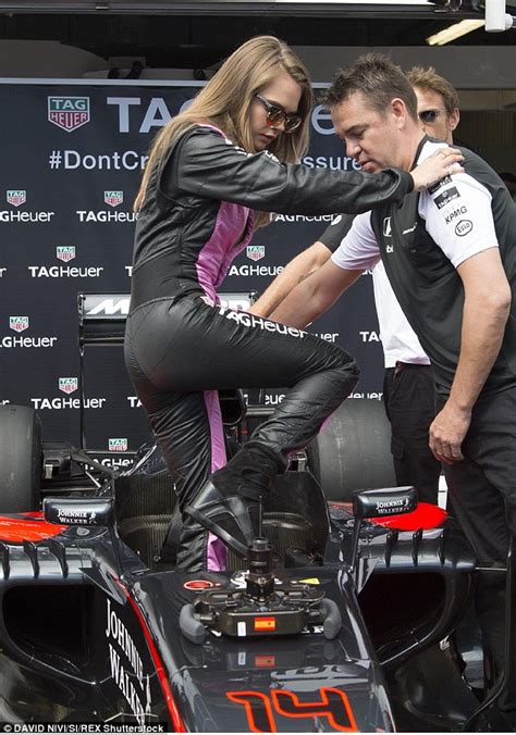 Cara Delevingne Gets Into The Grand Prix Spirit As She Dons Plunging Racer Jumpsuit And Metallic