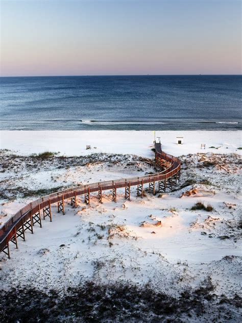 View Of The Beach With Wooden Walkway Beach And Gulf Waters 1 Stock