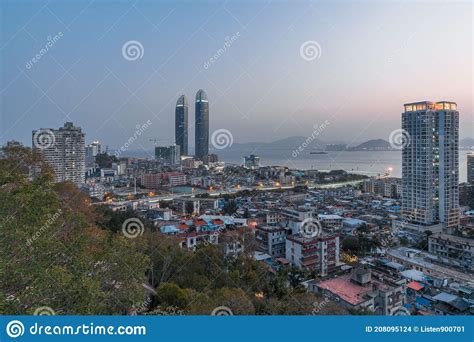 Xiamen City Skyline With Modern Buildings Old Town And Sea At Dusk
