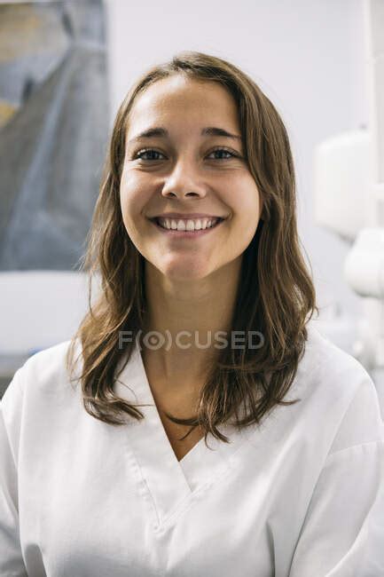 Smiling Beautiful Female Dentist Assistant In Dental Clinic — Confidence Dental Health Stock