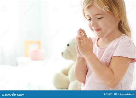 Little Girl Praying In Bed At Home Stock Photo Image Of Believe