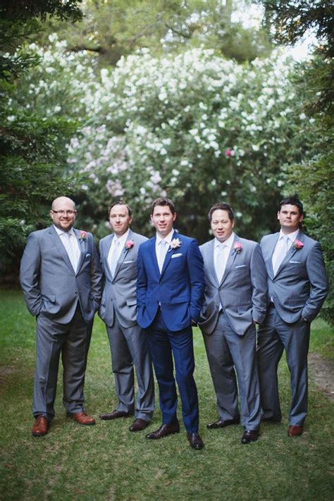 Groomsmen in navy suits with dusty blue ties. I like the blue suit on the groom with gray on his ...