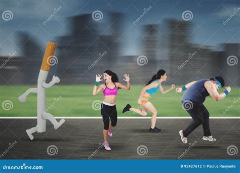 Overweight Man Is Chased By A Cigarette Stock Image
