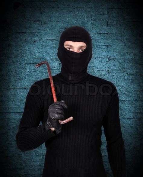 Mugger In Mask With Nail Puller On Blue Stock Image Colourbox