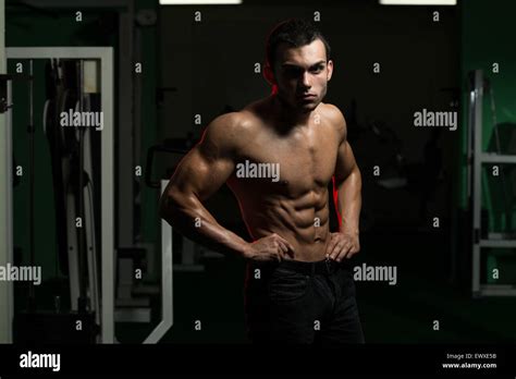 Young Muscular Men Flexing Abdominal Muscles Stock Photo Alamy