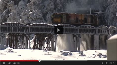 Spectacular Footage Train Plowing Through Deep Snow In