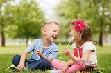 Little brother and sister enjoy lollipops and having fun in the – Fiber ...