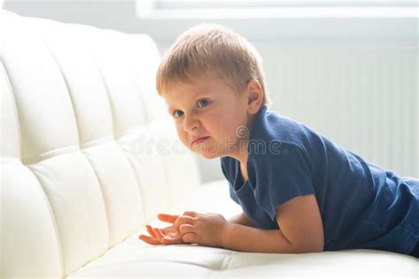 Portrait Of Hysterical Boy Upset Caucasian Kid Crying At Home Stock