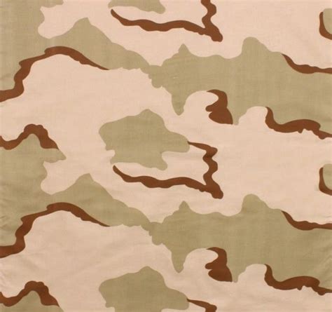 An Army Camouflage Fabric With Brown And White Colors