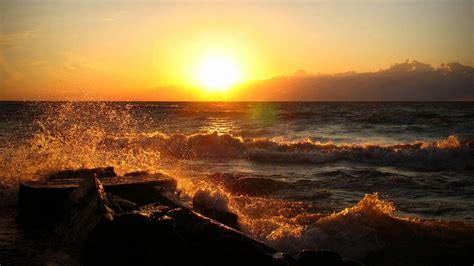 Download Yellow Ocean Sunset And Waves Wallpaper