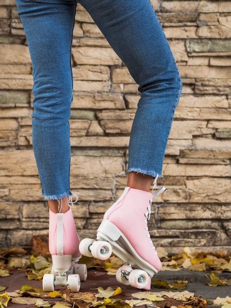 Free Photo Woman Posing In Jeans With Roller Skates