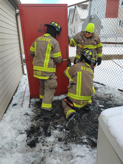 firefighters practice forcible entry techniques rescue hose company 1