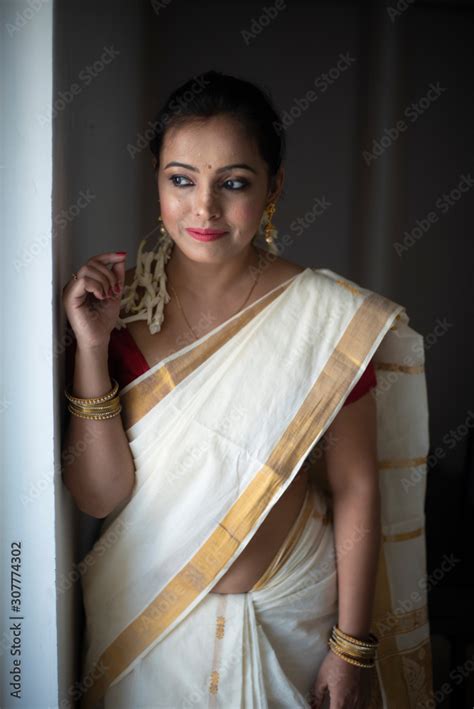 Portrait Of An Young And Attractive Indian Woman In White Traditional