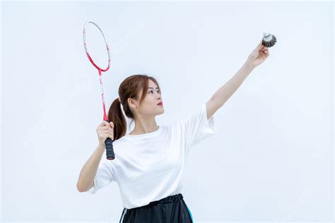Athletic Female Holding Badminton Racket Ready To Kick Off Background