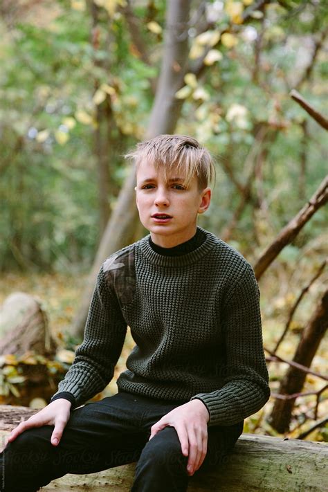 Teenage Boy Outdoors In The Woods By Stocksy Contributor Helen Rushbrook Stocksy