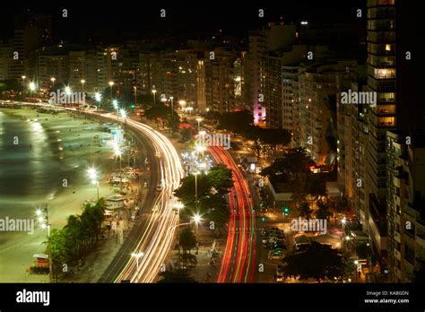 Traffic Along Avenida Atlantica And Copacabana Beach At Dusk Rio De