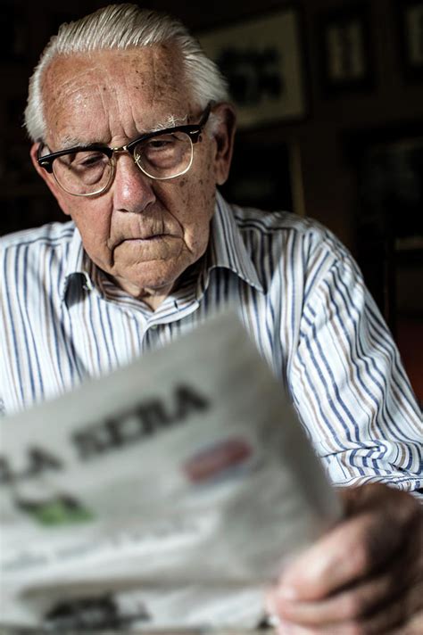 Elderly Man Reading A Newspaper Photograph By Mauro Fermariello