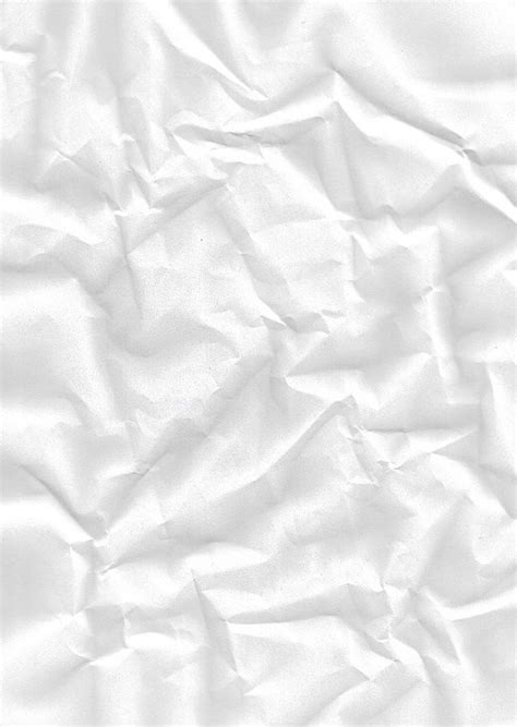White Crumpled Paper Is Shown In This Image