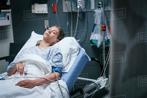 Caucasian Girl Sleeping In Hospital Bed Stock Photo Dissolve