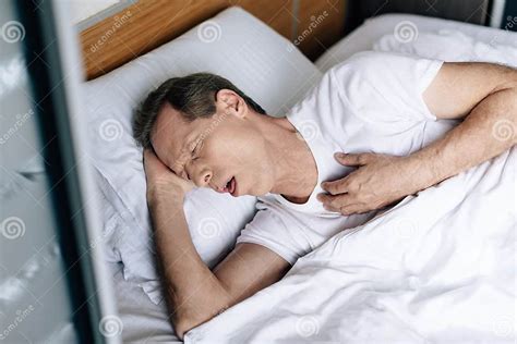 View Of Sick Man Coughing While Lying On Bed Stock Image Image Of