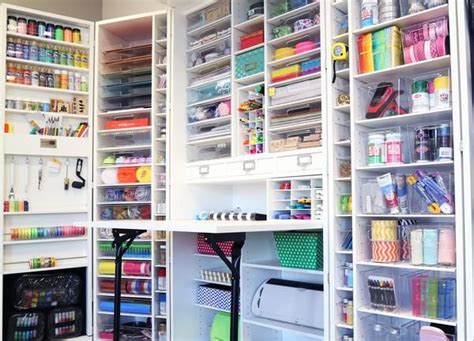 An Organized Closet With Lots Of Crafting Supplies And Storage Bins On