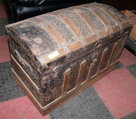 Antique Humpback Trunk With Embossed Gilt