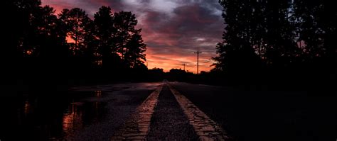 Download Wallpaper 2560x1080 Road Sunset Marking Trees Dual Wide