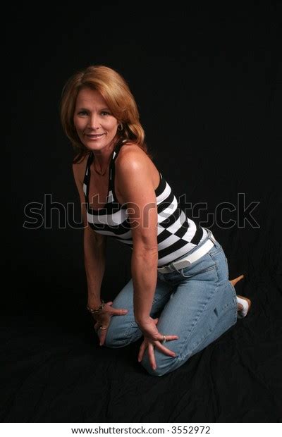 Pretty Mature Woman Kneeling Hands On Stock Photo Shutterstock