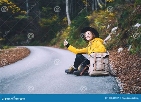 Woman Hitchhiker By The Roadside Among Autumn Forest Stock Image Image Of Journey Autostop