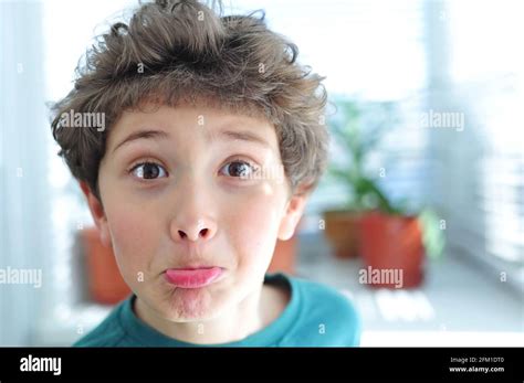 Cute Little Boy Makes Funny Faces Stock Photo Alamy