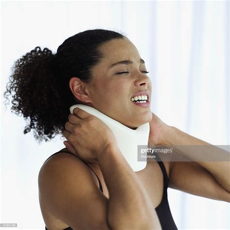 Young Woman Wearing A Neck Brace High Res Stock Photo Getty Images