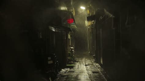 Establishing Shot Of Dark Alleyway With Chinese Lantern Blowing In