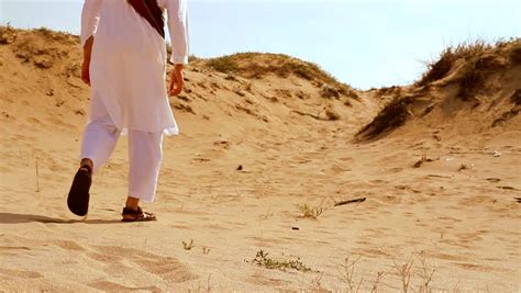 Arab Man Walking In Desert Hd Stock Footage Video 3913775 Shutterstock