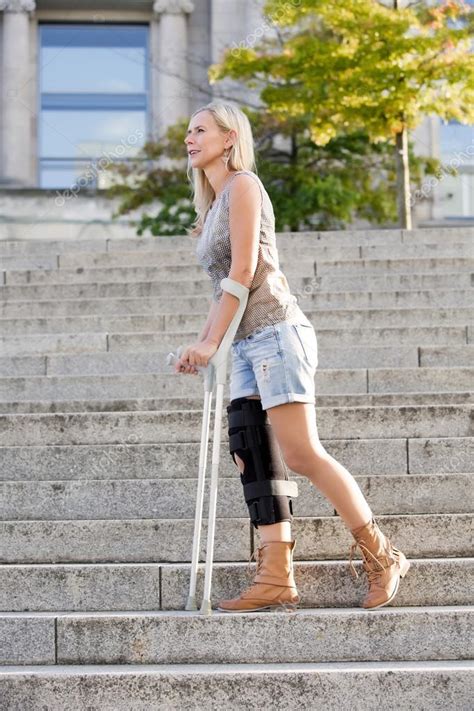 Blonde Woman With Crutches — Stock Photo © Wernerimages 53933437