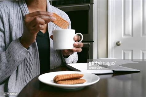 Woman Dunking Cookie Photos And Premium High Res Pictures Getty Images