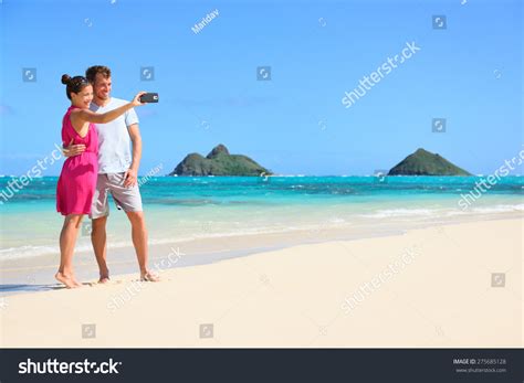 Couple On Beach Vacation Taking Selfie Photograph Using Smartphone Lanikai Beach Oahu Hawaii