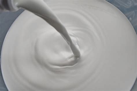Premium Photo Milk Splashing Waves Isolated White Background