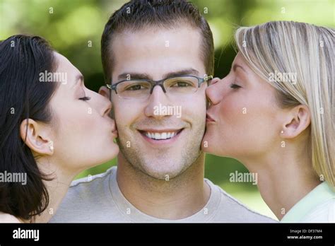 Lucky Guy Gets Kisses From Two Beautiful Women Stock Photo Alamy