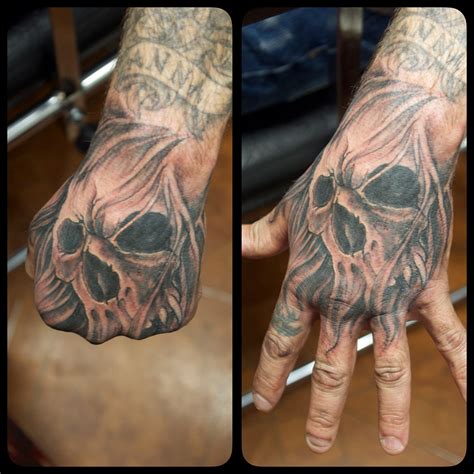 Skull Hand Tattoo Hand Tattoos Pictures Hand Tattoo Images Picture Tattoos Skull Rose Tattoos