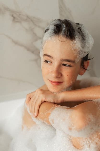 Premium Photo Teenager Takes A Bubble Bath