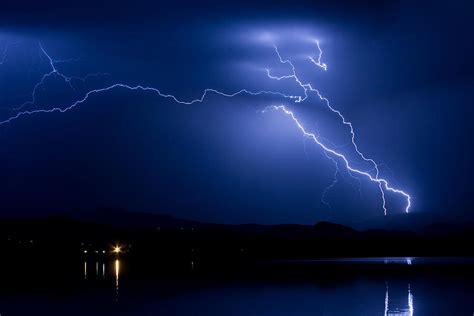 Blue Lightning Sky Over Water Photograph By James Bo Insogna