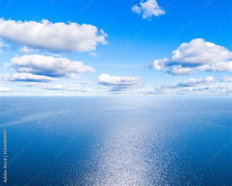 Aerial View Of A Blue Sea Water Background And Sun Reflections Aerial