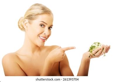 Healthy Nude Woman Pointing On Cuckooflower Stock Photo 261393704