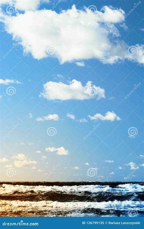 Beautiful Seascape With Sea Waves Blue Sky And White Cumulus Clouds