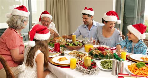 The meals are often particularly rich and substantial, in the tradition of the christian feast day celebration, and form a significant part of gatherings held to celebrate the arrival of christmastide. Happy Extended Family At The Christmas Dinner Table At Home In The Dining Room Stock Footage ...