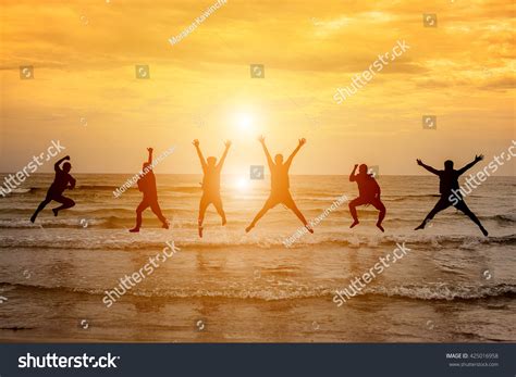 Group Happy People Jumping Sea Sunset Stock Photo Edit Now